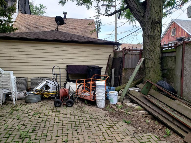 OPEN Center’s back patio before improvements.  The focus of the green stormwater intervention – the building gets some basement flooding due to improperly disconnected downspouts and old pavers. The intervention will make the space usable for community programming and visitors to the gallery.