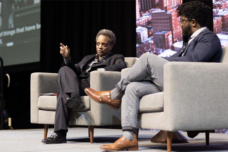 Lori E. Lightfoot with City Bureau Director and journalist Darryl Holliday discussing  innovative ideas to lift people out of poverty.