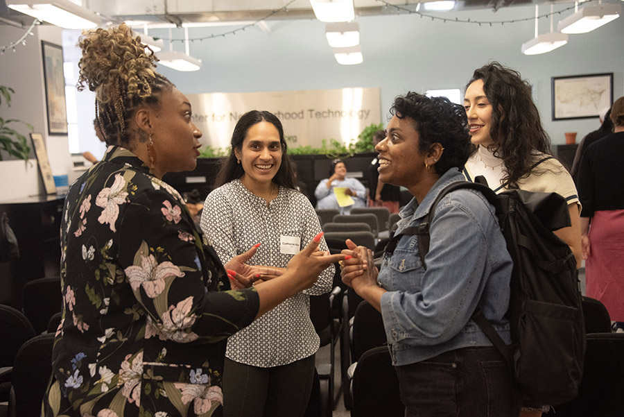 Attendees networking at CNT's Visionary Voices event on July 10